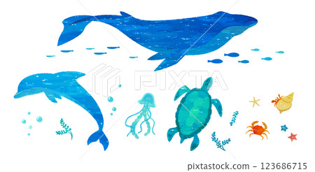 Hand-drawn illustrations of whales and dolphins. Sea creatures drawn with prints, stamps, collages, and watercolors. 123686715