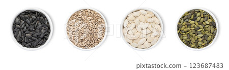Bowl plates with healthy organic pumpkin and sunflower seeds with shell isolated on white Bowl plates with healthy organic pumpkin and sunflower seeds with shell isolated on white 123687483