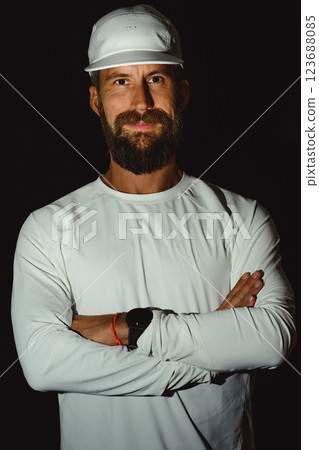 Portrait of a young bearded man with shirt and hat 123688085
