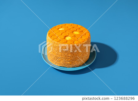 Medovik, honey layered cake, in bright light minimalist on a blue table Medovik, honey layered cake, in bright light minimalist on a blue table 123688296