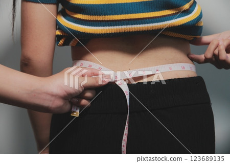 Women body fat belly. Obese woman hand holding excessive belly fat. diet lifestyle concept to reduce belly and shape up healthy stomach muscle. Women body fat belly. Obese woman hand holding excessive belly fat. diet lifestyle concept to reduce belly and shape up healthy stomach muscle. 123689135