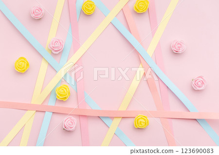 Paper strips with rosebuds on pink background Paper strips with rosebuds on pink background 123690083