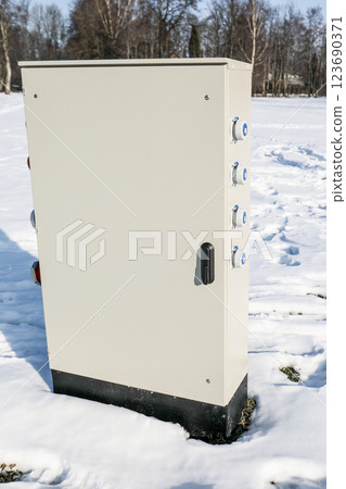 Outdoor Electrical Distribution Box in Snowy Winter Landscape Outdoor Electrical Distribution Box in Snowy Winter Landscape 123690371