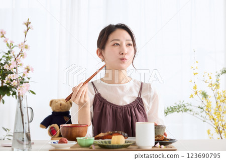A woman eating breakfast at a dining A woman eating breakfast at a dining 123690795