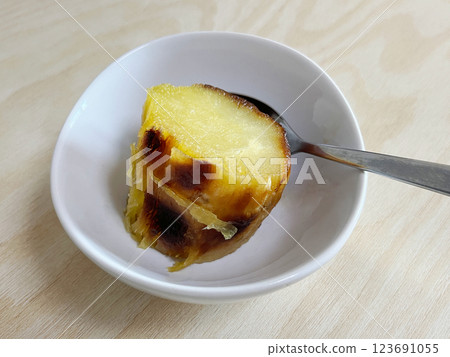 Eat baked sweet potato with a spoon Eat baked sweet potato with a spoon 123691055