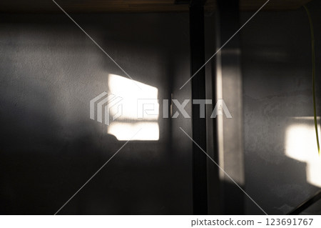 Light And Shadows Falling On The Walls In A Dark Room, Background for advertising and wallpaper in structure and buildings scene 123691767