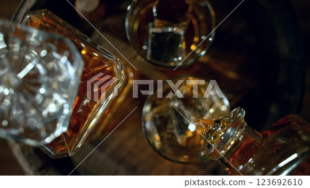 Detail of pouring whiskey into drink. Freeze motion of drink preparation. 123692610