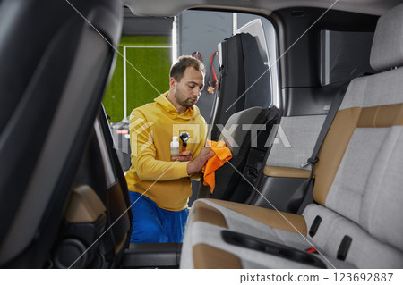Service master working at car wash service Service master working at car wash service 123692887