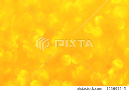 Yellow golden orange bokeh glitter background backdrop.  123693245