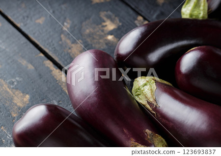 Heap of Ripe Eggplants on Dark Background, Eggplants Harvest, Copy Space Heap of Ripe Eggplants on Dark Background, Eggplants Harvest, Copy Space 123693837