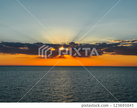 scenery, sea and sunset on the horizon with clouds 123693845