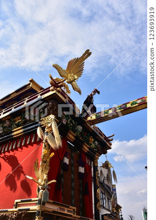 Takayama City, Gifu Prefecture, Japan, Spring Takayama Festival, Karakuri puppet floats on stone platform and beautiful blue sky 123693919