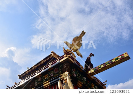 Takayama City, Gifu Prefecture, Japan, Spring Takayama Festival, Karakuri puppet floats on stone platform and beautiful blue sky Takayama City, Gifu Prefecture, Japan, Spring Takayama Festival, Karakuri puppet floats on stone platform and beautiful blue sky 123693931