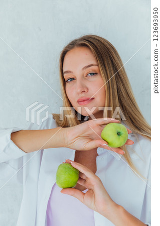 Beautiful woman holding green apples for diet 123693950