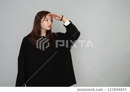 Stylish 16-year-old in a sleek black hoodie, perfect for youth advertising and versatile branding options 123694655