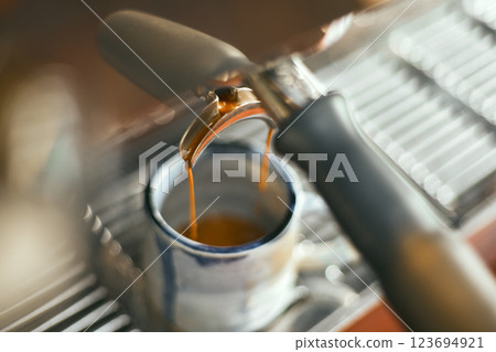 Close up of coffee machine pouring espresso in cafe 123694921