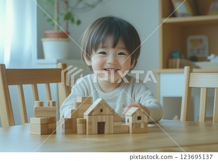 Toddler boy playing with building blocks 123695137