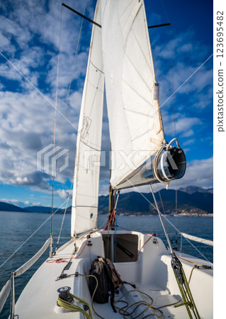 Sports yacht sailing in the Kotor Bay, Montenegro, representing adventure, freedom, and nautical exploration. Sports yacht sailing in the Kotor Bay, Montenegro, representing adventure, freedom, and nautical exploration. 123695482