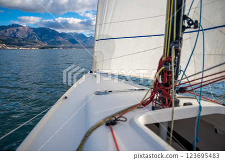 Sports yacht sailing in the Kotor Bay, Montenegro, representing adventure, freedom, and nautical exploration. Sports yacht sailing in the Kotor Bay, Montenegro, representing adventure, freedom, and nautical exploration. 123695483