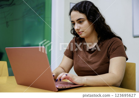 Latin woman using a computer 123695627