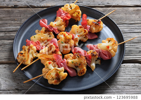 spicy cauliflower kebabs with corned beef on plate spicy cauliflower kebabs with corned beef on plate 123695988