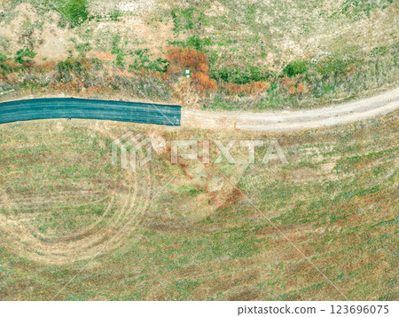 Aerial View of Winding Road and Open Fields 123696075