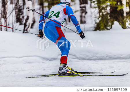 man skier athlete participating cross-country skiing race man skier athlete participating cross-country skiing race 123697509