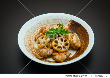 Chicken and lotus root stir-fried in sweet and sour sauce with coriander Chicken and lotus root stir-fried in sweet and sour sauce with coriander 123698207