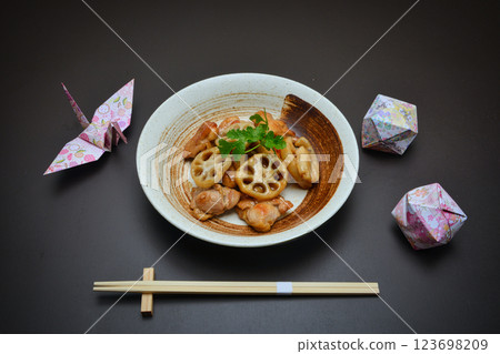 Chicken and lotus root stir-fried in sweet and sour sauce with coriander Chicken and lotus root stir-fried in sweet and sour sauce with coriander 123698209
