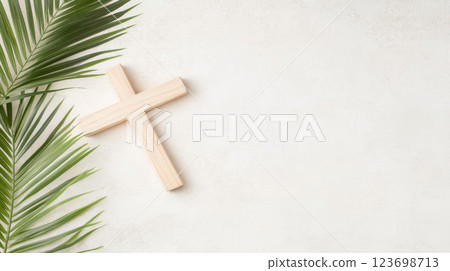Palm Sunday symbol with wooden cross and green palm leaves, suitable for backgrounds 123698713