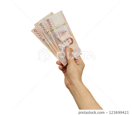 Asian woman holding Thai baht banknote money in hand isolated on white background. Asian woman holding Thai baht banknote money in hand isolated on white background. 123699421