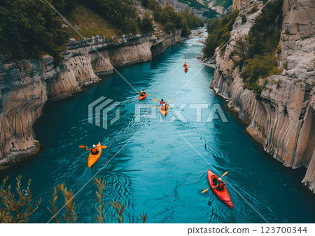 People enjoying kayaking on narrow river in rocky mountains area on sunny summer day.AI Generative. 123700344