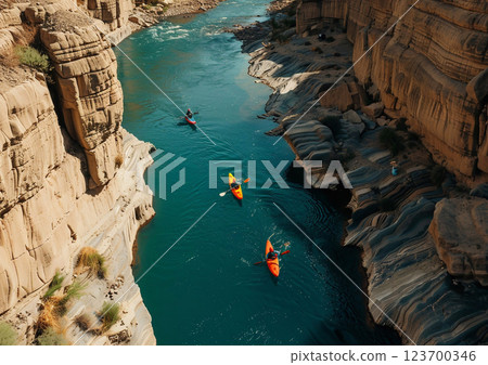 People enjoying kayaking on narrow river in rocky mountains area on sunny summer day during vacation holiday trip.Drone view.AI Generative. People enjoying kayaking on narrow river in rocky mountains area on sunny summer day during vacation holiday trip.Drone view.AI Generative. 123700346