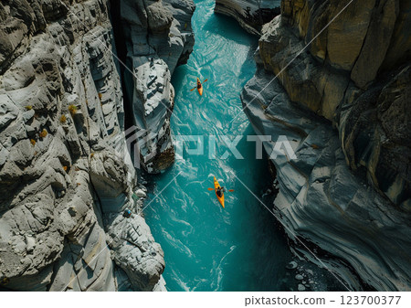 Group of kayaking on narrow river between rocky mountains on sunny summer day.AI Generative. Group of kayaking on narrow river between rocky mountains on sunny summer day.AI Generative. 123700377