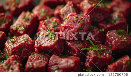Cubed pieces of raw low fat goulash beef pieces on table wit herbs and spices.Macro.AI Generative. 123700706