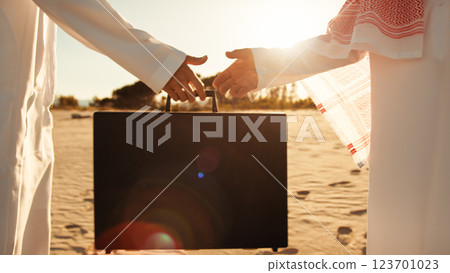 Two Sheiks Completing The Deal Passing The Money Briefcase Two Sheiks Completing The Deal Passing The Money Briefcase 123701023