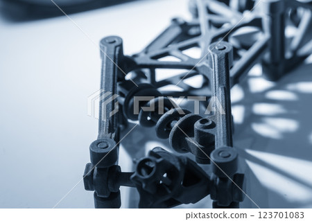 Close up scene the additive manufacturing by 3D printer machine in the light blue scene. 123701083