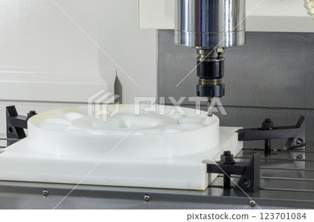 The CNC milling machine cutting the nylon parts with solid ball end mill tool. The CNC milling machine cutting the nylon parts with solid ball end mill tool. 123701084
