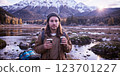 girl with backpack hiking in mountains 123701227