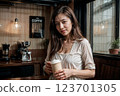 young woman drinking coffee in a cafe 123701305