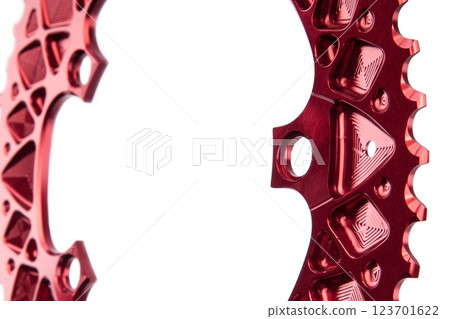 Close up of a red oval bicycle chainring against white isolated background. Professional bicycle part. Close up of a red oval bicycle chainring against white isolated background. Professional bicycle part. 123701622