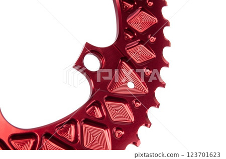 Close up of a red oval bicycle chainring against white isolated background. Professional bicycle part. Close up of a red oval bicycle chainring against white isolated background. Professional bicycle part. 123701623