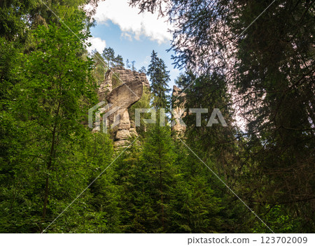 Majestic sandstone cliffs surrounded by lush greenery and forests for tourism, ecotourism 123702009