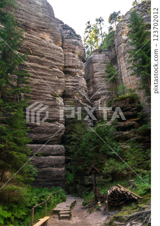 Majestic sandstone cliffs surrounded by lush greenery and forests for tourism, ecotourism 123702012