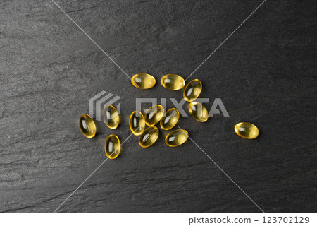 Coenzyme q10, coq10 Pills, q10, Omega 3 Fish Oil Capsules, Yellow Pills, Vitamin D Pill, Soft Golden Capsule Drugs Coenzyme q10, coq10 Pills, q10, Omega 3 Fish Oil Capsules, Yellow Pills, Vitamin D Pill, Soft Golden Capsule Drugs 123702129