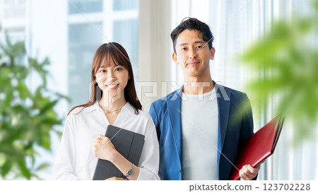 Image of business teamwork between two men and women 123702228