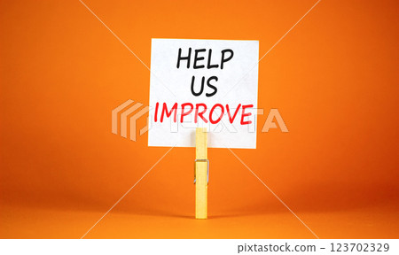 Help us improve symbol. Concept words Help us improve on beautiful white paper on clothespin. Beautiful orange background. Business motivational help us improve concept. Copy space. Help us improve symbol. Concept words Help us improve on beautiful white paper on clothespin. Beautiful orange background. Business motivational help us improve concept. Copy space. 123702329