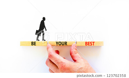 Motivational be your best symbol. Concept words Be your best on beautiful wooden blocks. Beautiful white background. Businessman hand. Business motivational be your best concept. Copy space. Motivational be your best symbol. Concept words Be your best on beautiful wooden blocks. Beautiful white background. Businessman hand. Business motivational be your best concept. Copy space. 123702358
