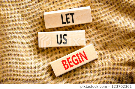 Let us begin symbol. Concept words Let us begin on beautiful wooden blocks. Beautiful canvas table canvas background. Business motivational let us begin concept. Copy space. Let us begin symbol. Concept words Let us begin on beautiful wooden blocks. Beautiful canvas table canvas background. Business motivational let us begin concept. Copy space. 123702361