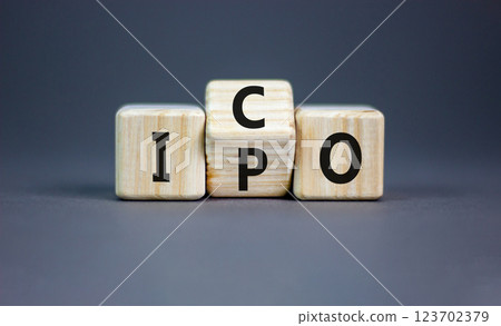 Initial public or coin offering symbol. Concept words abbreviation IPO or ICO on wooden block. Beautiful grey table grey background. Business Initial public or coin offering concept. Copy space. 123702379